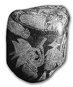 "Ica stone" depicting ancient astronomer searching for asteroid remnants of Marduk.