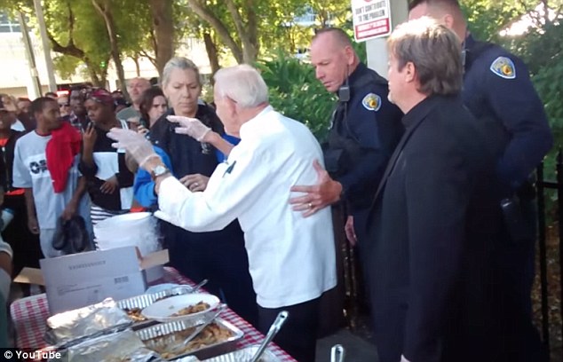 90-year-old Arnold Abbott is stopped by reluctant police for breaking Fort Lauderdale's new law against giving food to the homeless.