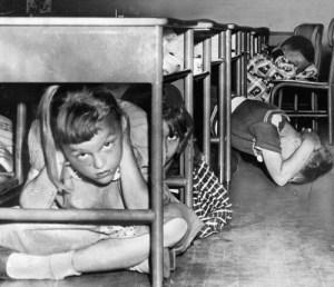 I was among that generation of schoolkids, shown here, who hid under their desks during civil defense drills of the 1950s... as a way to survive a nuclear attack. Didn’t make a lot of sense even then, but grown-ups felt compelled to do SOMEthing to prepare for a hopeless situation.